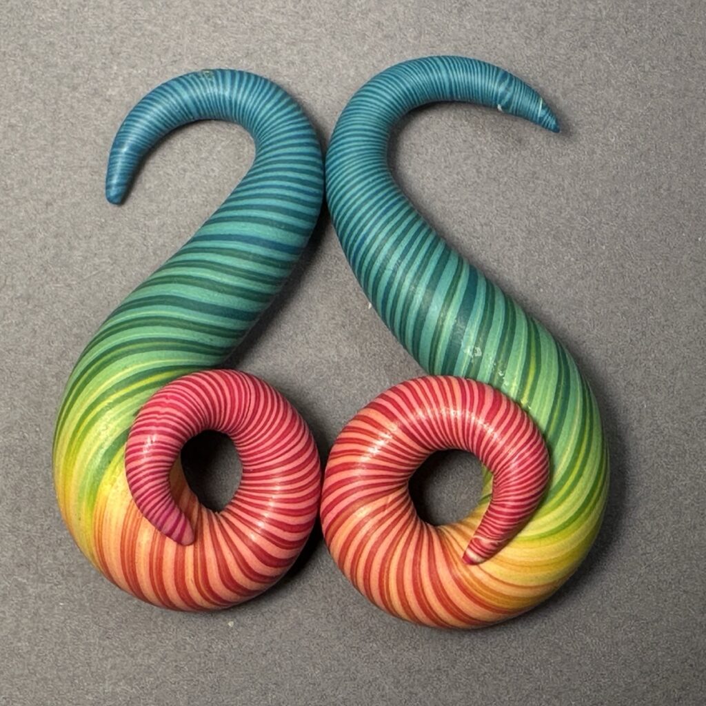 Rainbow spiral polymer clay gauge earrings, teal fading down to red curls